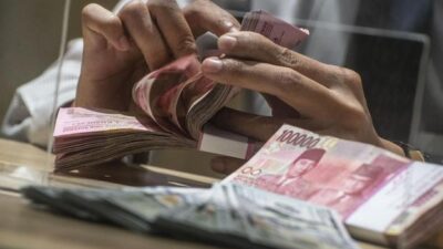 Rupiah Didorong Stimulus dan Bunga Acuan AS Naik ke Rp14.120